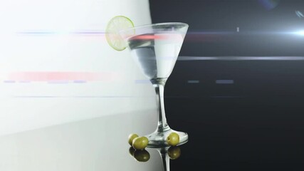 After pause lime wheel appearing on martini glass rim, olives cascading into glass and filling it - Powered by Adobe