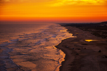 Fire sunset at Torres beach Brazil