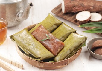 Lemet Singkong, Utri or Ketimus is a snack made from grated cassava, given brown sugar, wrapped in...