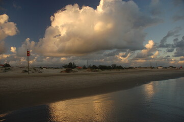 Sunset at the beach with clouds