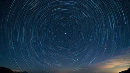 Mesmerizing Time-Lapse of Star Trails Circling the North Star in the Night Sky - Powered by Adobe