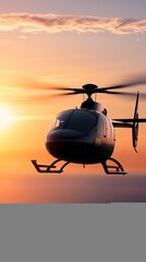Modern black helicopter flying at sunset with vibrant orange sky and soft clouds, aerial transportation vehicle in scenic view