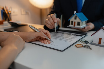 staff is explaining the information about the house lease contract documents to the buyer, the...