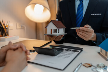 staff is explaining the information about the house lease contract documents to the buyer, the...