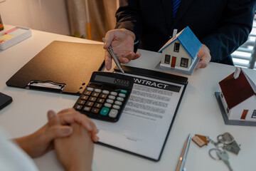 staff is explaining the information about the house lease contract documents to the buyer, the...