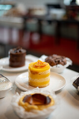 Delicious Yellow Layered Mango Cake on a White Plate
