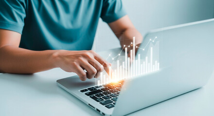 Person analyzing data on a laptop computer 