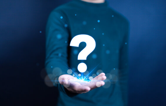 Man showing question mark, concept of asking, answering, business FAQ, thinking and wondering, brainstorming and problem solving.