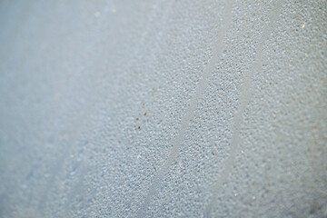 Dew drop on the car glass window during raining. Dew is the moisture that forms as a result of...