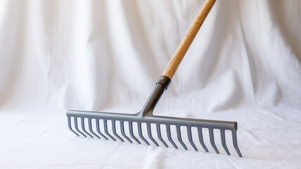 Naklejka premium A high-quality product photograph of a garden rake on a pure white background.