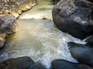 clear river current and large rocks