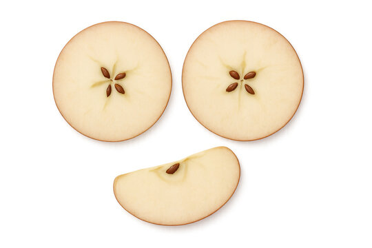 Fresh red apple slices exposing seeds, presenting natural texture and vibrant color on clear background