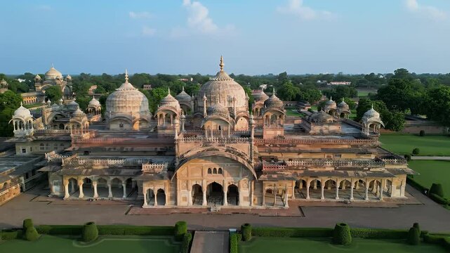 Chhatri of Orchha Ancient Indian Architecture with Multiple Domes Surrounded by Lush Green Park Under Clear Blue Sky