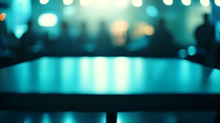 Atmospheric Meeting: An abstract shot of a meeting room table with blurry people silhouette in background and glowing ambient lights set an atmosphere of anticipation and collaboration.