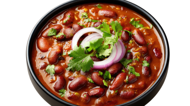 Kidney Bean Curry in Bowl: A hearty and flavorful kidney bean curry, simmered to perfection, is served in a rustic black bowl, garnished with fresh cilantro and red onion rings. - Powered by Adobe