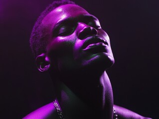 Close-Up Portrait of a Sweating Man in Purple and Green Spotlights