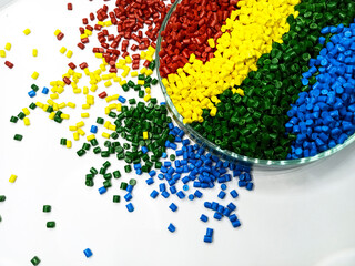 various colors of masterbatch granules in glass containers, polymer carrying resin and pigments...