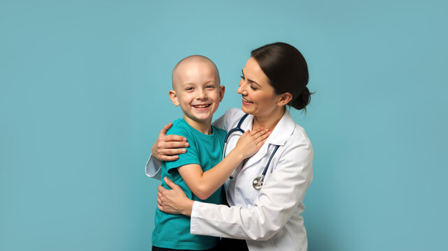 Smiling bald boy with a female doctor on a blue background. Happy child cancer patient and oncologist. Pediatric care and hope concept.