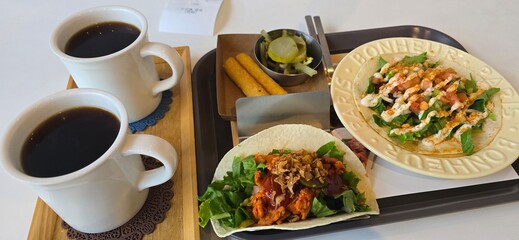Coffee and taco on a table
