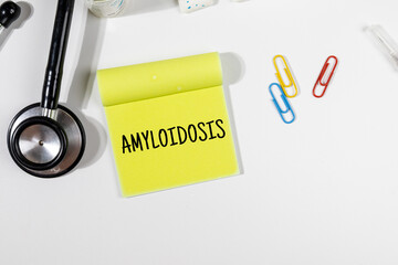 A Note with “Amyloidosis” on Doctor's Desk – Rare Protein Disorder Concept