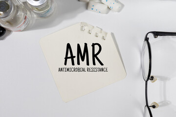  A Note with “Antimicrobial Resistance (AMR)” on Doctor's Desk – Global Health Threat Concept