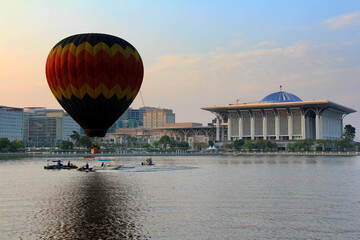 A hot air balloon flies near a mosque in Putrajaya, Malaysia