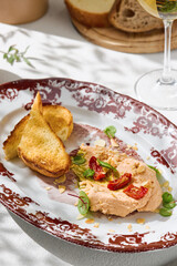 Hummus with tomatoes and toast, bright sunlight, overhead plating arrangement