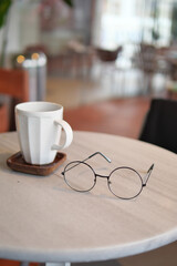 Coffee and glasses on a table in a modern cafe
