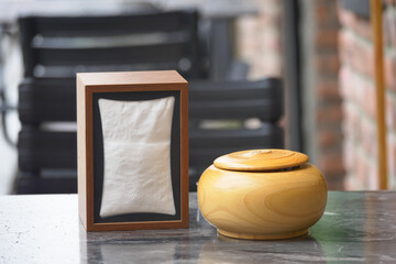 Container and napkin holder on outdoor table in cafe
