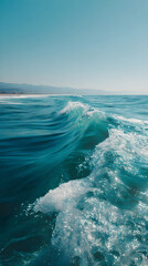 Infinite Turquoise: Capturing the Mesmerizing Dance of Ocean Waves Under Azure Skies with Shimmering Sunlit Crests