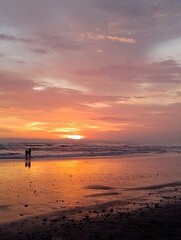 Beautiful portrait photography on the beach at golden hour sunset.
Dramatic sea sunset with reflection of sunlight over water surface.