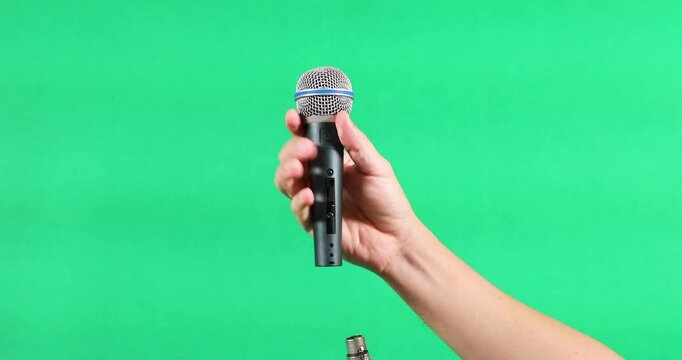 Plug in the green background microphone cable.