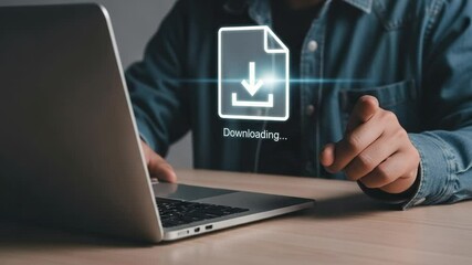 Person using laptop with a download icon and downloading text on the screen in a close up view - Powered by Adobe