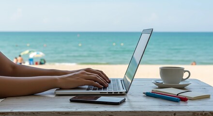 digital nomad working on a laptop at a beach cafe. with a laptop and  coffee 
