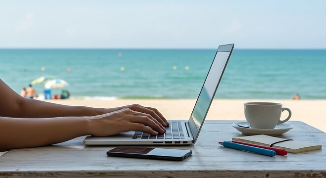 digital nomad working on a laptop at a beach cafe. with a laptop and coffee - Powered by Adobe