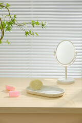 Natural light bath corner with handheld mirror, brush, and soft-colored soap. Calm minimalist scene with blank wooden surface ready for product mockups or design use.