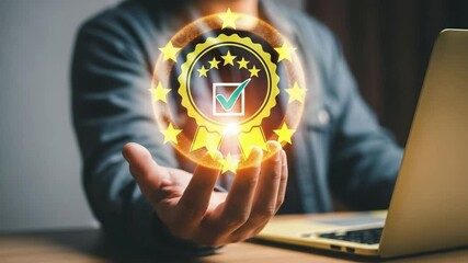 Person holding a glowing quality assurance seal with stars above a laptop on a wooden surface