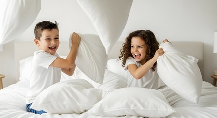 Kids having fun pillow fight on bed