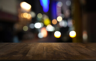 Empty wood table top and blur of restaurant background selective focus product display