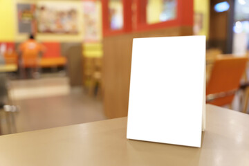 Menu mock up blank for text marketing promotion. Mock up Menu frame standing on wood table in restaurant space for text