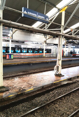 Bandung Train Station Platform with Destination Sign and Train