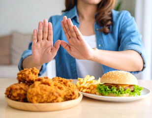 Woman makin Hand Sign to Refuse a Hamburger