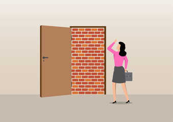 a businesswoman standing in surprise as she faces a solid brick wall