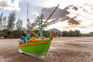 Fishing boat beached on Sam Roi Yot Beach, Prachuap Khiri Khan, Thailand