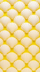 Shells Arranged In Grid Formation Over Bright Yellow Background