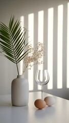 Minimalist Home Decor Palm Leaf Vase Eggs and Glassware in Sunlit Room