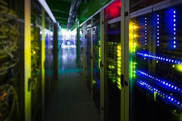 Server rack on right side is showing blinking LED panels in flat design corridor under cables