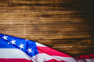 American flag section is draping over rustic wood in flat illustration showing stars stripes