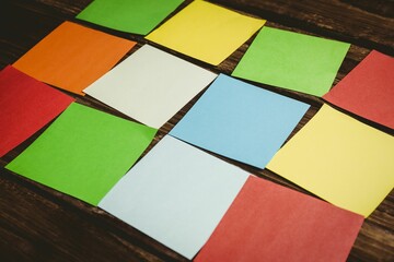 multi colored papers on wooden flooring
