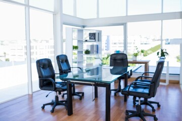 Glass meeting table and black swivel chairs are appearing in flat design office with potted plants